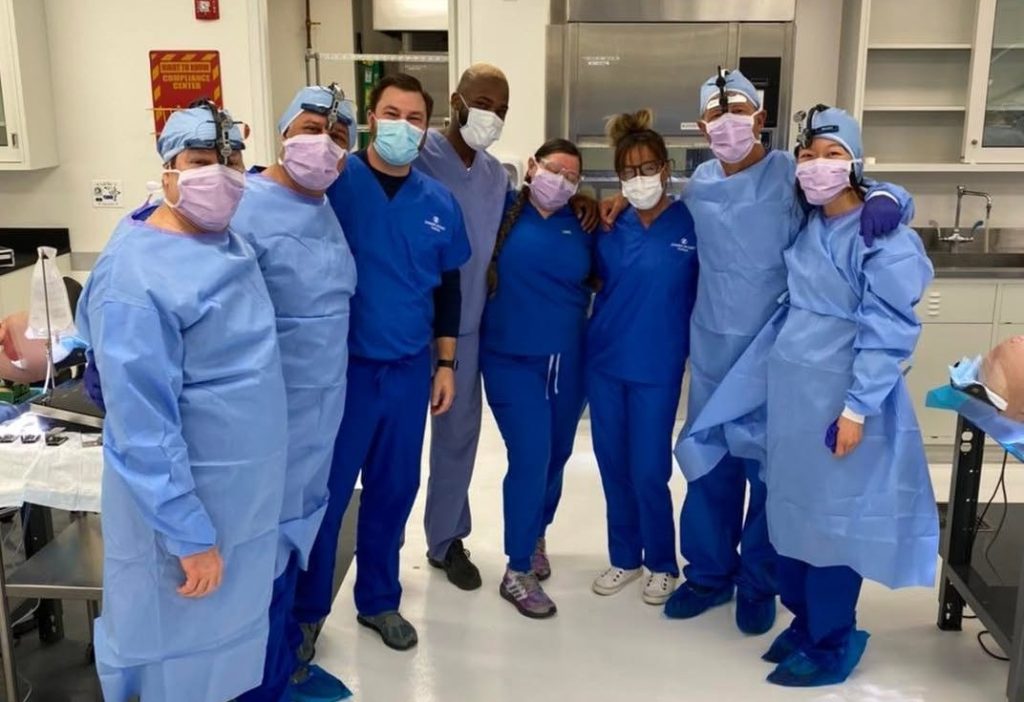 Dental professionals participating in a hands-on dental implant training program